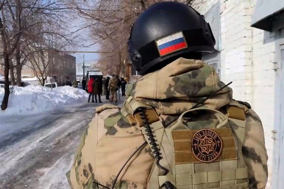 Screenshot from the FSB footage showing an officer’s uniform patch with a neo-nazi symbol.